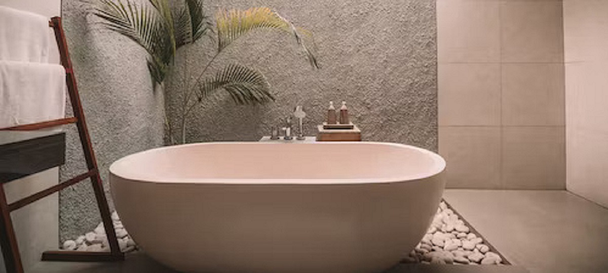 Image of a woman taking a sitz bath for postpartum recovery.