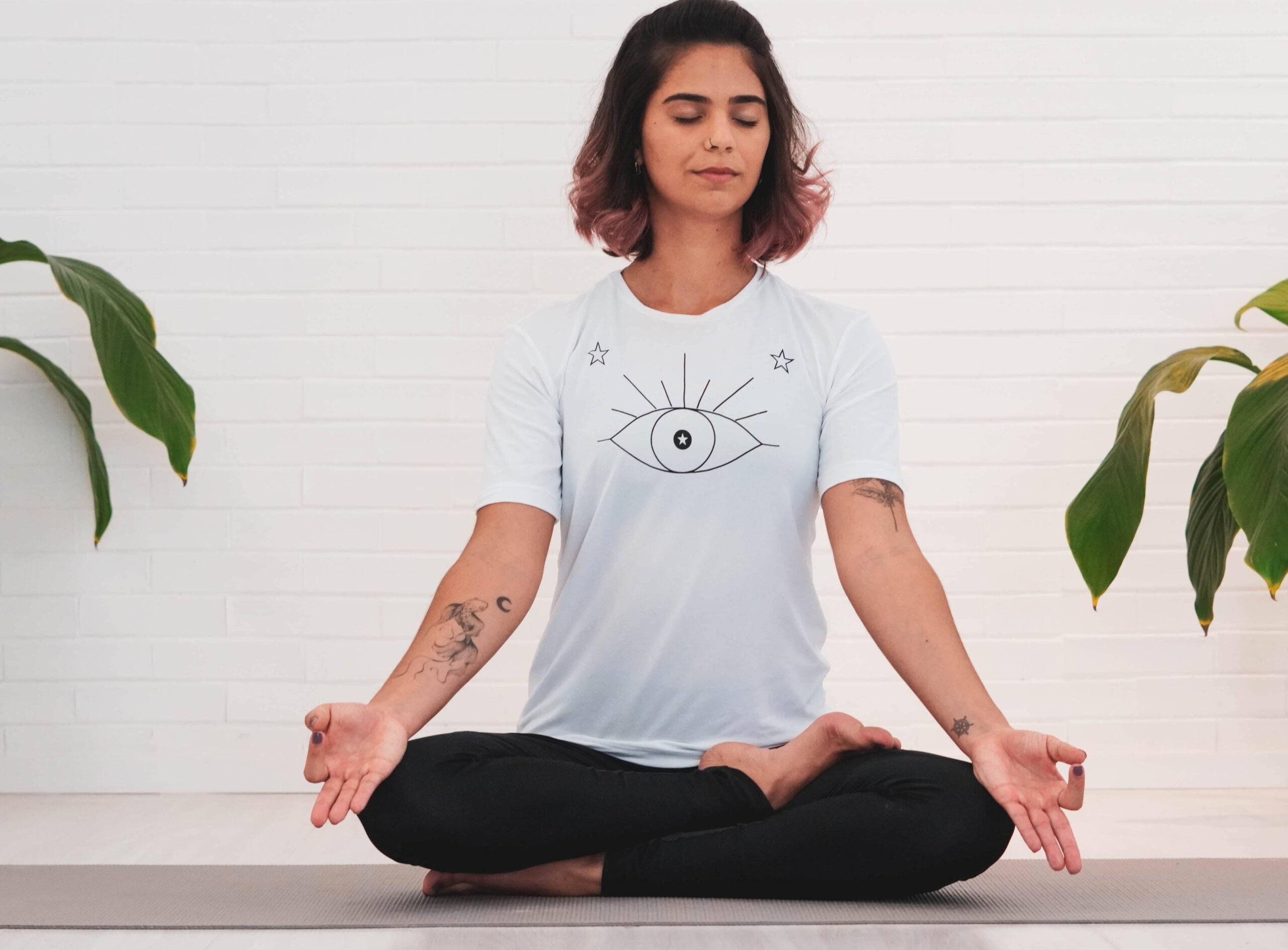 Yoga practitioner demonstrating deep breathing in a calming pose