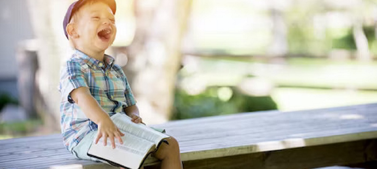 Dyslexic child engaged in reading with supportive teacher