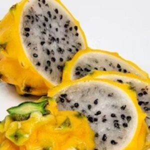 Slices of ripe golden yellow dragon fruit arranged beautifully on a plate, showcasing its vibrant colors and juicy texture.