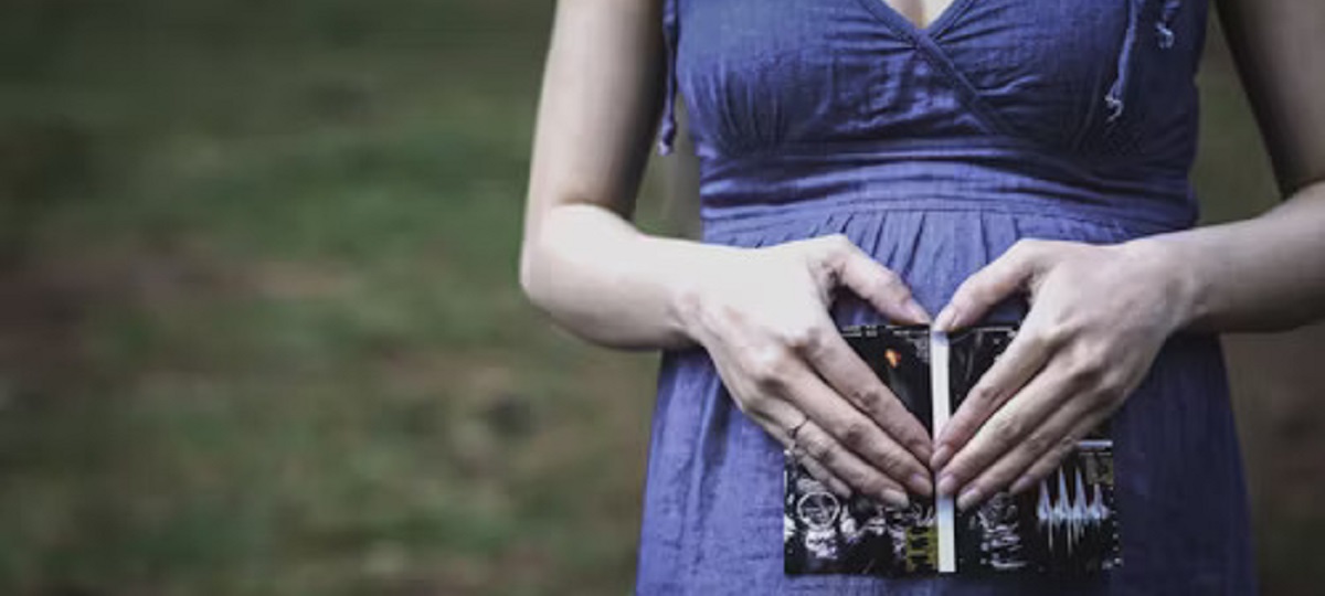 A diverse group of people holding hands, symbolizing support and unity in the adoption process for unplanned pregnancy.