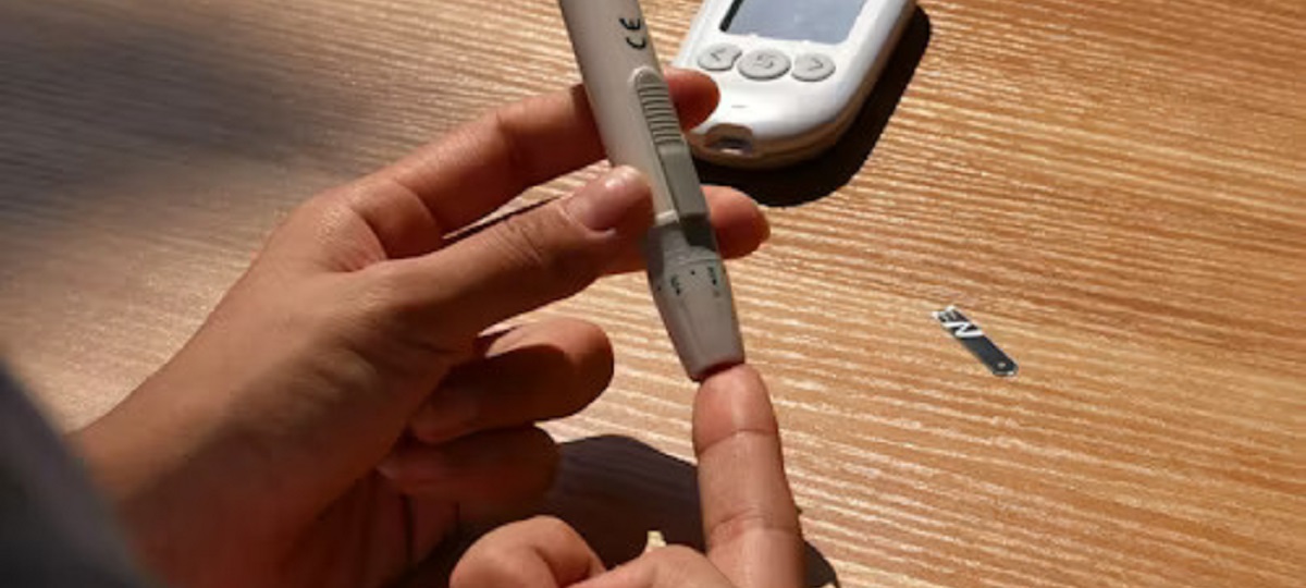 Pregnant woman monitoring blood sugar levels - Managing gestational diabetes with lifestyle changes and regular check-ups.